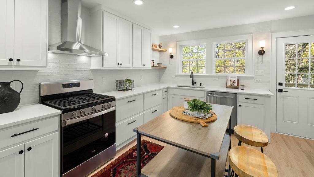 Remodeled white kitchen with clean counters
